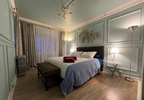 a bedroom with a bed with a red towel on it at House Of Lith in Punta Arenas