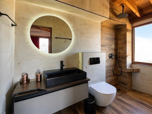 a bathroom with a sink and a toilet at Vila Laura in Ksamil
