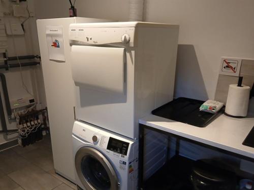 a kitchen with a refrigerator and a washing machine at Holiday Home Calli by Interhome in Give