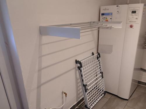 a white washer and dryer in a room at Holiday Home Calli by Interhome in Give