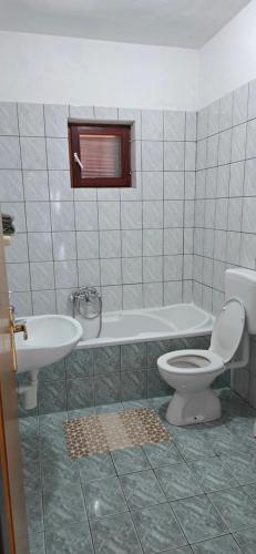 a bathroom with a toilet and a tub and a sink at Karmen 2 in Sveti Juraj