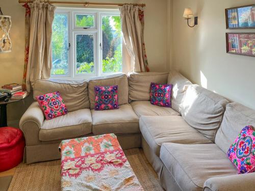 a living room with a couch and a window at St Anthonys in Ampleforth