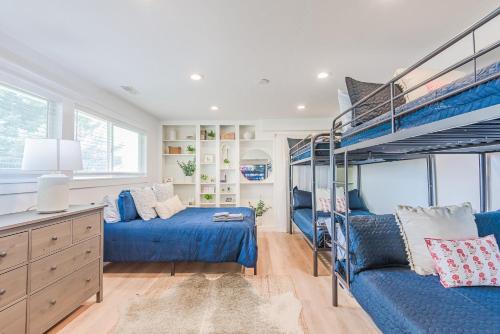 a bedroom with two bunk beds and a couch at 72 S Orem Upstairs Only in Orem