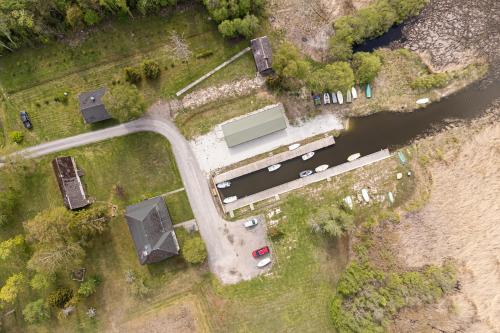 an aerial view of a parking lot next to a river at Suurlahe Guesthouse in Kuressaare