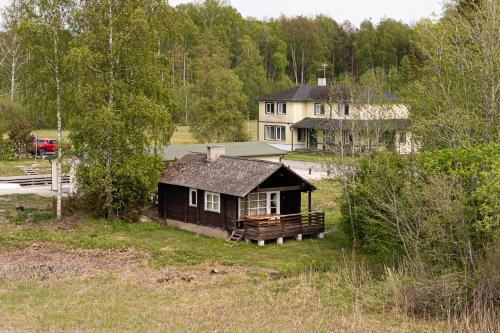 a small house in the middle of a field at Suurlahe Guesthouse in Kuressaare