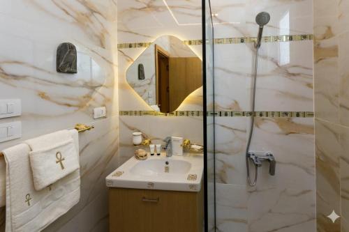 a bathroom with a sink and a shower at khofo pyramids view in Cairo