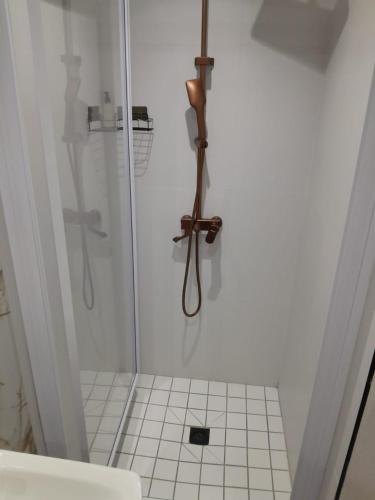 a bathroom with a shower with a glass door at Ultimate Grace in Pretoria