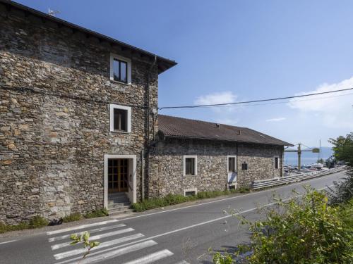 an old stone building on the side of a road at Apartment Leonard Lake by Interhome in Ghiffa