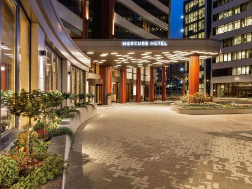 a building with a sign that reads welcome hotel at Mercure Sofia City in Sofia
