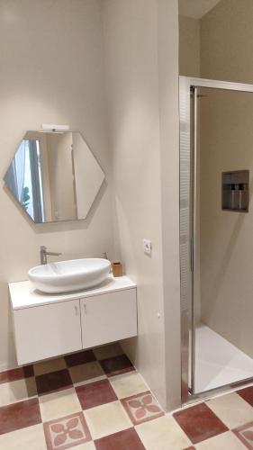 a bathroom with a sink and a mirror at Casa Ferrante in Lecce