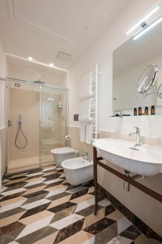 a bathroom with two sinks and a shower at Bambagina Mare in Amalfi