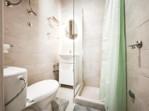 a bathroom with a toilet and a shower at Apartmani Vukovic in Budva