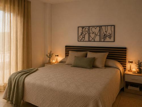 a bedroom with a large bed and a window at Garbinada in Gandesa