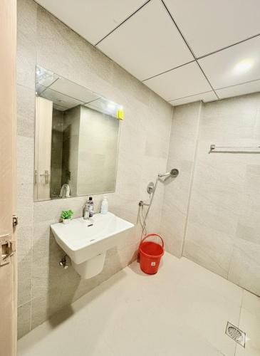 a bathroom with a sink and a shower at Glow Corner in Greater Noida