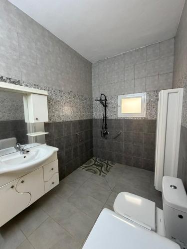 a bathroom with a sink and a toilet at Dar Sidi Mohamed in Zarzis