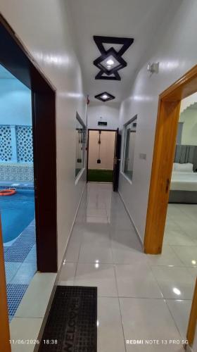 a hallway of a house with a swimming pool at شاليه سما in Taif