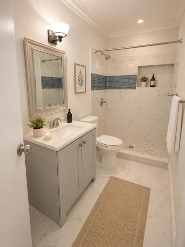 a white bathroom with a sink and a toilet at Santorini Shores in Biscayne Park
