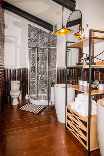 a bathroom with a tub and a toilet at 56 Crocodile in Komatipoort