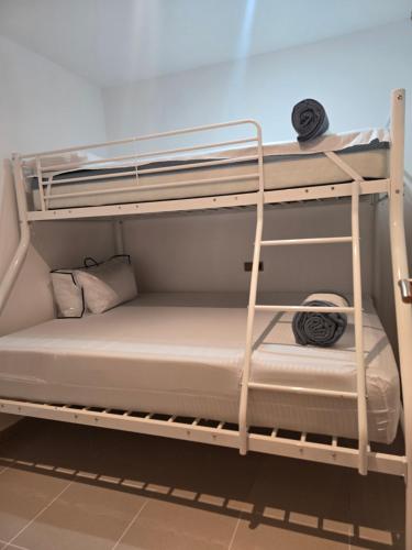 a couple of bunk beds in a room at PRIMERA LINEA DE PLAYA VILAFORTUNY in Vilafortuny