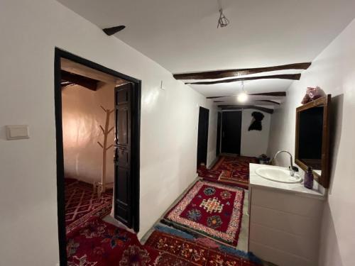 a bathroom with a sink and a mirror at Adrar view lodge in Imlil
