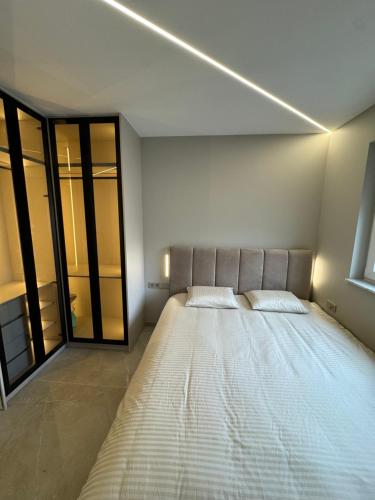 a bedroom with a large bed in a room at Esch City Studio in Esch-sur-Alzette