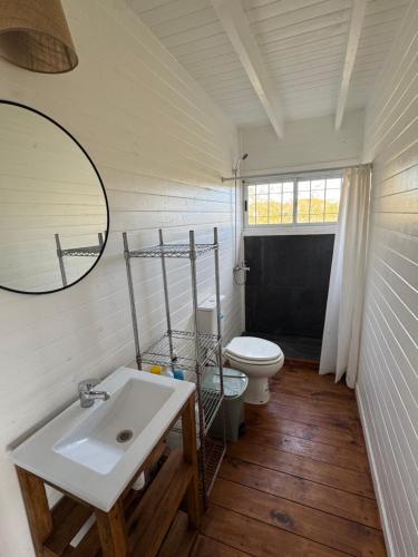 a bathroom with a sink and a toilet at Casa Sauce Delta in Tigre