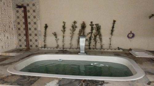 a large bath tub in a bathroom with at Solar da Colina in Petrolina