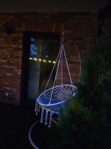 a blue bird bath with icicles hanging from it at Apartament Przystań in Łeba