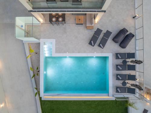 an overhead view of a swimming pool in a house at Agemaya Villas in Sami