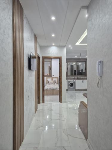 a room with a hallway with a bed in the background at Calm and facinating vacation in Saïdia