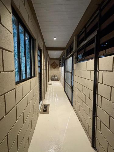 an empty hallway of a school with windows in a building at Vila Chacrinha apartamento 2 in Campo Limpo