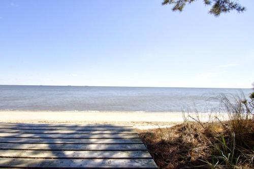 a path to the beach with the ocean in the background at 229 Bay Ave. in Milford
