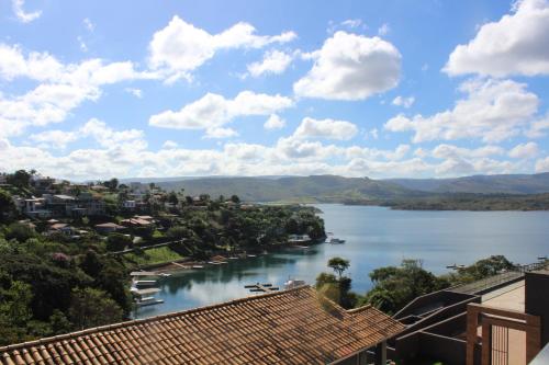 a view of a river with houses and a town at Summit Capitólio Hotel in Capitólio