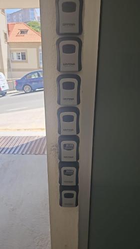 a row of buttons on the side of a surfboard at Apartamentos en playa Canido in Malpica