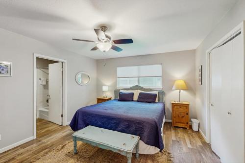 a bedroom with a bed and a ceiling fan at Dog-Friendly Lakefront Home with Private Sundeck in Kingsland