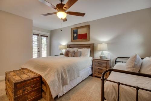 a bedroom with a bed and a ceiling fan at Lakefront Home with WiFi, Entertainment, Dock & Lake Views - Dogs OK in Buchanan Dam