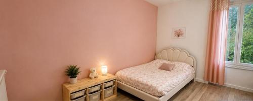 a small bedroom with a bed and a window at Maison de vacances in Capdenac-Gare