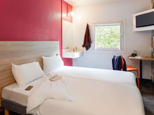 a hotel room with two beds and a sink at HOTELF1 Le Havre Est - Gonfreville in Gonfreville-lʼOrcher