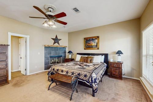 a bedroom with a bed and a ceiling fan at Waterfront Home with Kayak, View, Fire Pit & WiFi - Dog-Friendly in Buchanan Dam