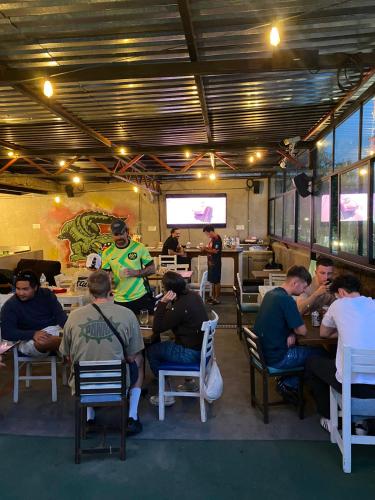 a group of people sitting at tables in a restaurant at Nomaddicts in Mexico City