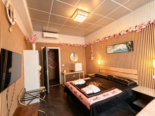 a bedroom with a large bed in a room at BED & BREAKFAST SAKURA in Milan