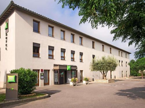 a large white building with a lot of windows at ibis Styles Carcassonne La Cité in Carcassonne