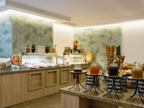 a buffet line with bread and pastries on display at ibis Styles Makkah in Mecca
