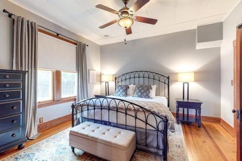 a bedroom with a bed and a ceiling fan at Enchanting Home with Fireplace, Full Kitchen, Patio, Central AC, & Washer/Dryer in Fredericksburg