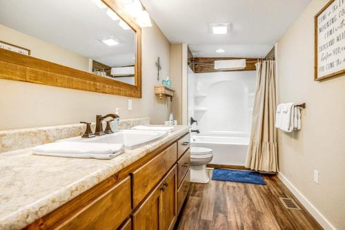 a bathroom with a sink and a toilet and a tub at Expansive Getaway Near Downtown with Fast WiFi, Grill in Fredericksburg