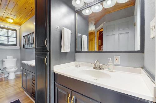 a bathroom with a sink and a mirror at Ranch Home with Hot Tub on 7 Secluded Acres - Minutes to Downtown Fredericksburg in Fredericksburg