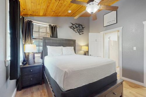a bedroom with a bed and a ceiling fan at Ranch Home with Hot Tub on 7 Secluded Acres - Minutes to Downtown Fredericksburg in Fredericksburg