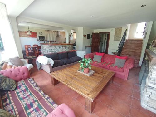 a living room with a couch and a table at Las Asturianas in San Carlos de Bariloche