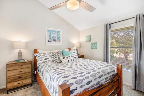 a bedroom with a bed and a window at Two-Story Waterfront Retreat with Boat Dock, Two Firepits & Two Kayaks in Burnet