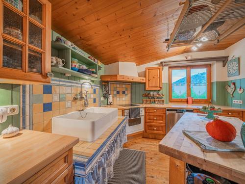 a large kitchen with a sink and a counter at Panoramahaus Itter in Itter